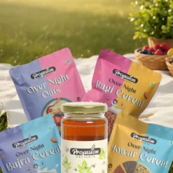 Healthy breakfast combo with Overnight Oats, Bajra, Ragi, Jowar Cereal Mixes and Tulsi Honey in a natural picnic setup